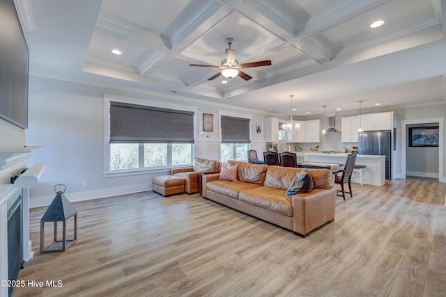 living room with a fireplace, coffered ceiling, beam ceiling, and light wood-style floors