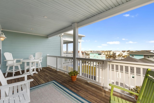 wooden deck featuring a residential view