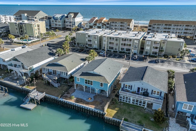 birds eye view of property with a water view and a residential view