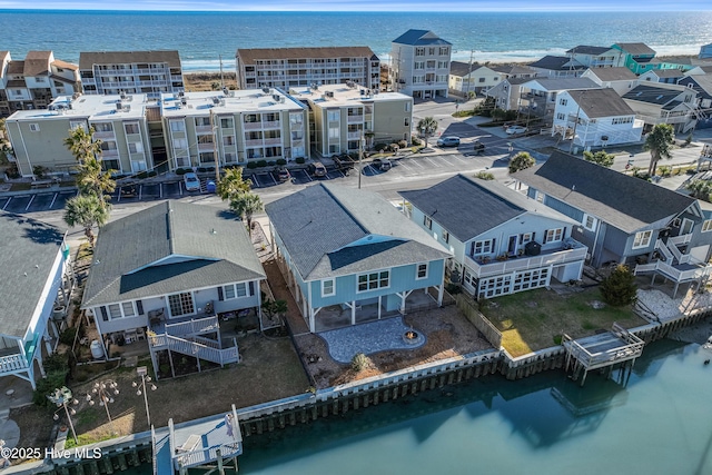 aerial view featuring a residential view and a water view