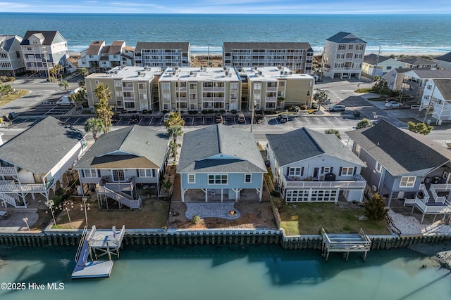 aerial view with a water view and a residential view