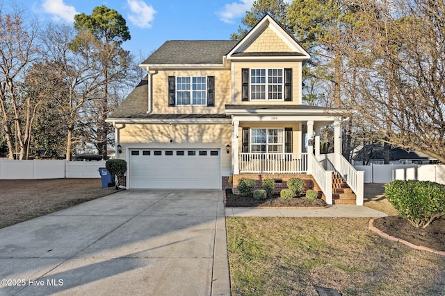 view of front of house featuring driveway, a garage, fence, and a porch