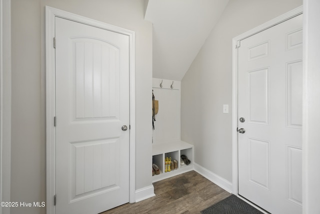 mudroom with lofted ceiling, baseboards, and dark wood-style flooring