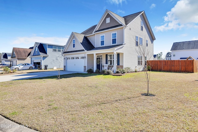 view of front of property featuring fence, a porch, a front yard, a garage, and driveway