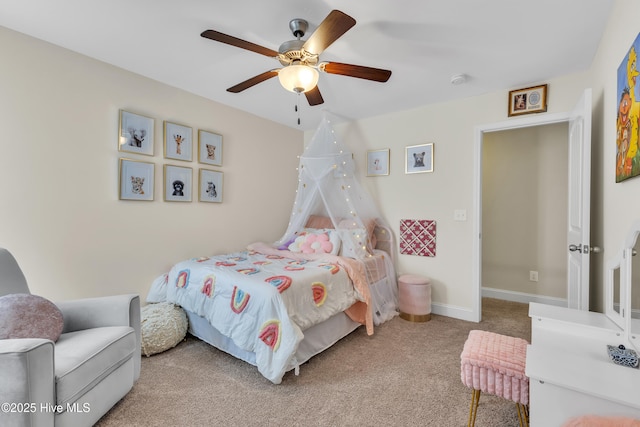 carpeted bedroom with baseboards and a ceiling fan