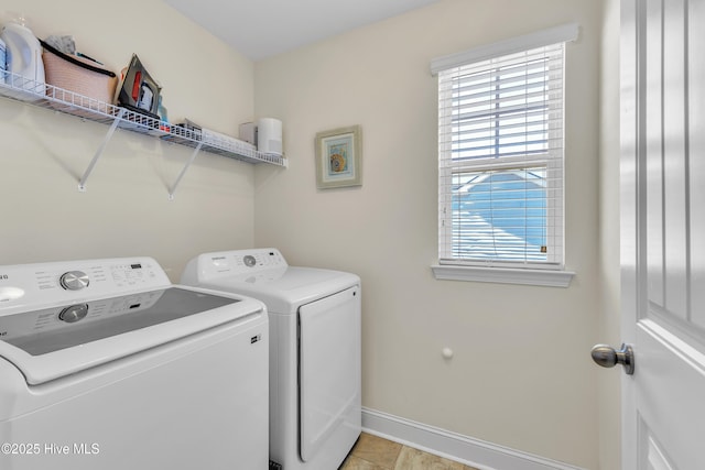 laundry area featuring laundry area, light tile patterned floors, baseboards, and independent washer and dryer