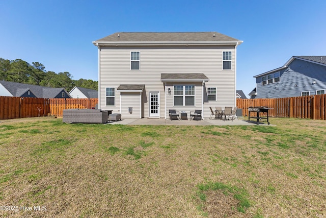 rear view of property with a yard, an outdoor hangout area, a fenced backyard, and a patio area