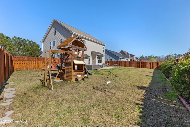 exterior space featuring a fenced backyard and a playground