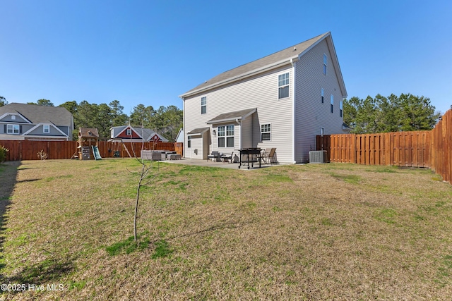 rear view of property with a fenced backyard, central AC, a playground, a patio area, and a lawn