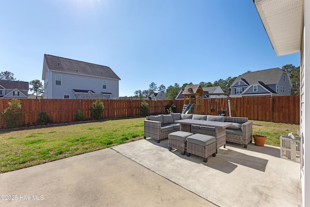 view of patio featuring an outdoor living space and a fenced backyard