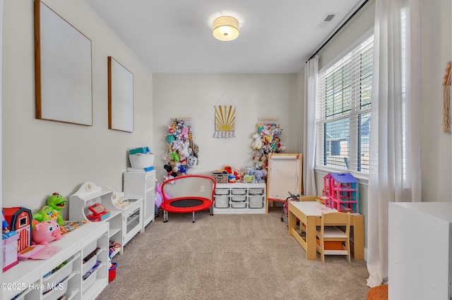 recreation room featuring visible vents and carpet