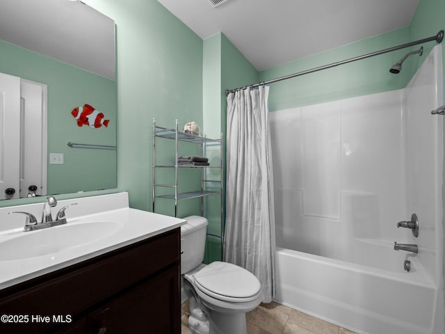 full bath with vanity, tile patterned flooring, shower / bath combo with shower curtain, and toilet