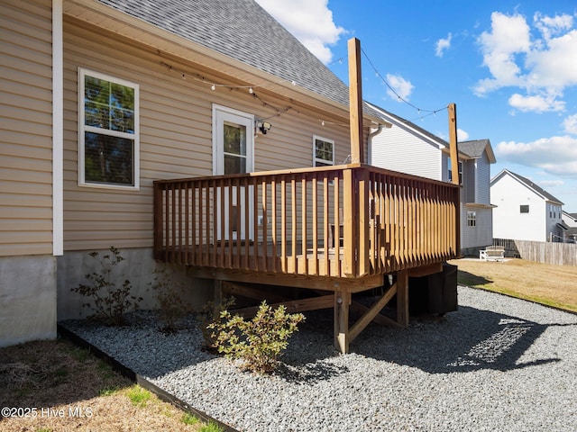 wooden terrace featuring fence