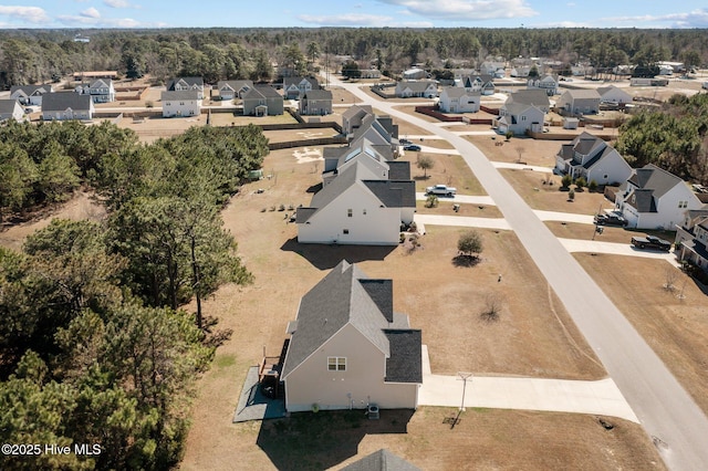 birds eye view of property with a residential view