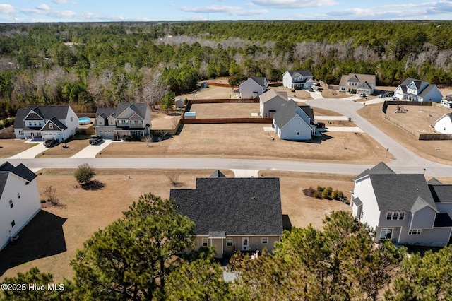 aerial view with a residential view and a view of trees