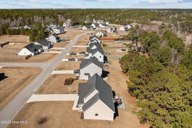 aerial view featuring a residential view and a forest view