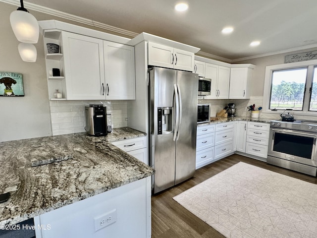 kitchen with a peninsula, white cabinets, appliances with stainless steel finishes, open shelves, and crown molding