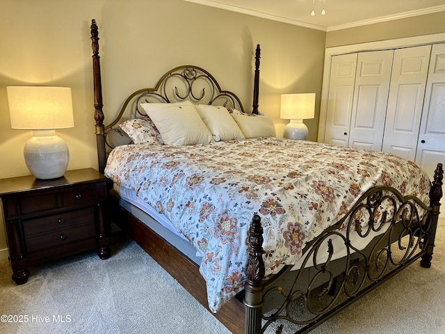 bedroom with a closet, carpet flooring, and crown molding