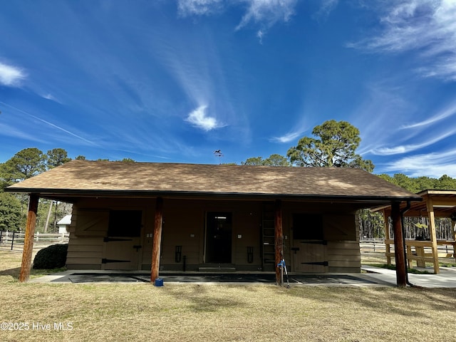 view of front of house with roof with shingles