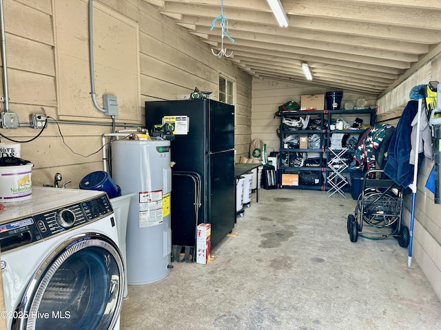 interior space featuring water heater, freestanding refrigerator, and washer / dryer