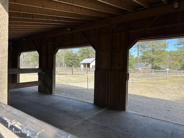 view of stable featuring a rural view