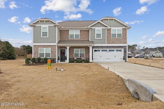 view of front of property with a garage, driveway, brick siding, and a front yard