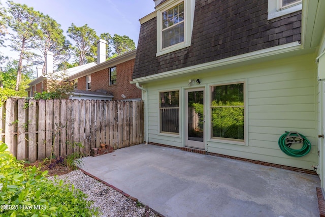view of patio / terrace featuring fence