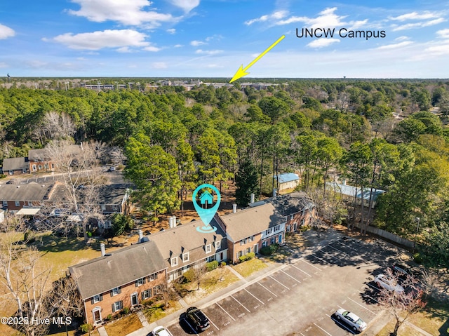 drone / aerial view with a view of trees