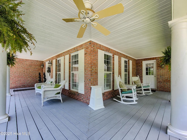 deck with a porch and a ceiling fan