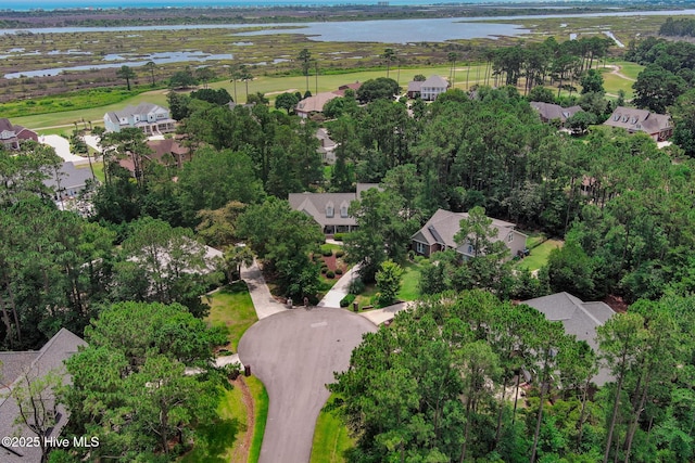 drone / aerial view featuring a residential view and a water view