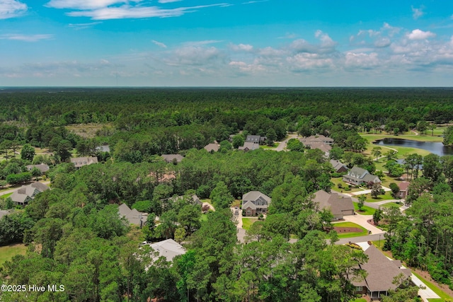 aerial view featuring a water view, a wooded view, and a residential view