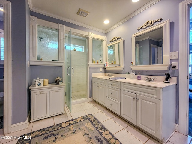 bathroom with crown molding, visible vents, a sink, a shower stall, and tile patterned flooring