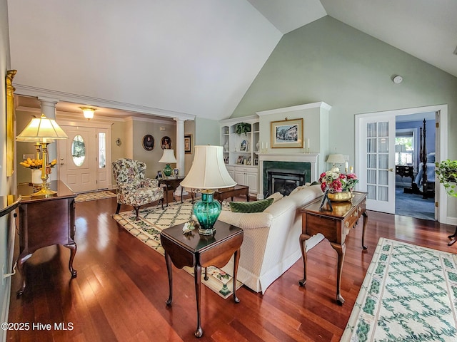 living area featuring french doors, a glass covered fireplace, high vaulted ceiling, and wood finished floors