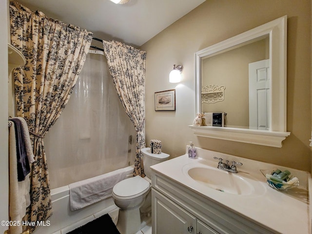 bathroom featuring toilet, shower / bath combo, and vanity