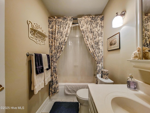 bathroom featuring shower / bath combo, vanity, toilet, and tile patterned floors