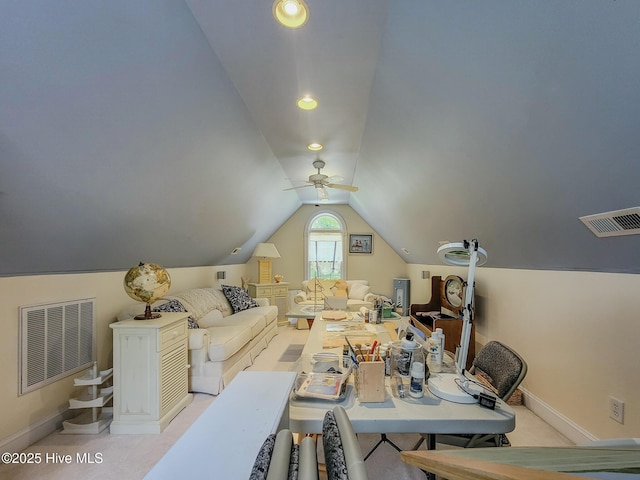 interior space featuring baseboards, visible vents, and vaulted ceiling