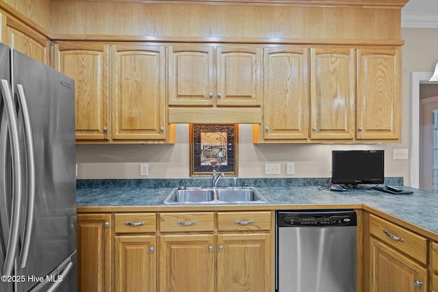 kitchen featuring appliances with stainless steel finishes, crown molding, and a sink