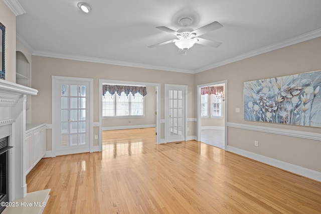 unfurnished living room featuring a fireplace with flush hearth, baseboards, light wood-style flooring, and crown molding