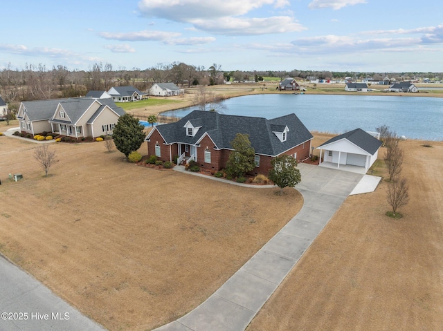 aerial view featuring a water view and a residential view