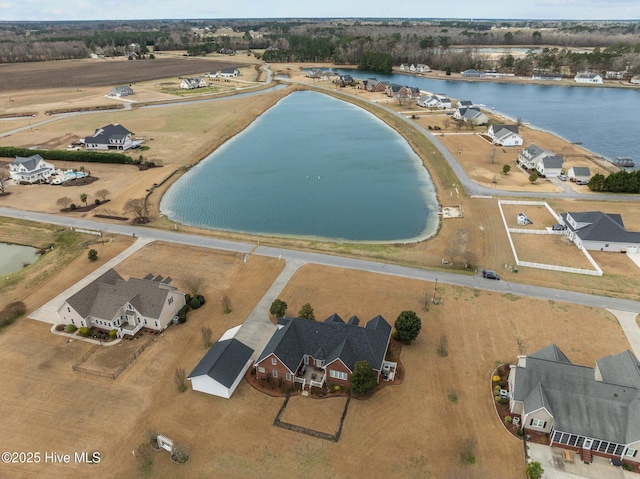 bird's eye view featuring a water view and a residential view