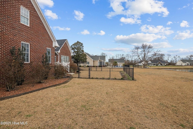 view of yard with fence and a residential view