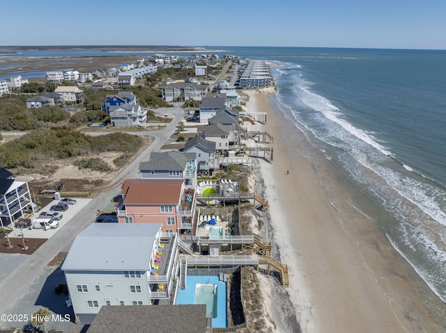 bird's eye view with a water view and a view of the beach