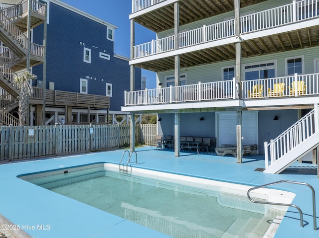 view of pool with a patio area, fence, and a fenced in pool