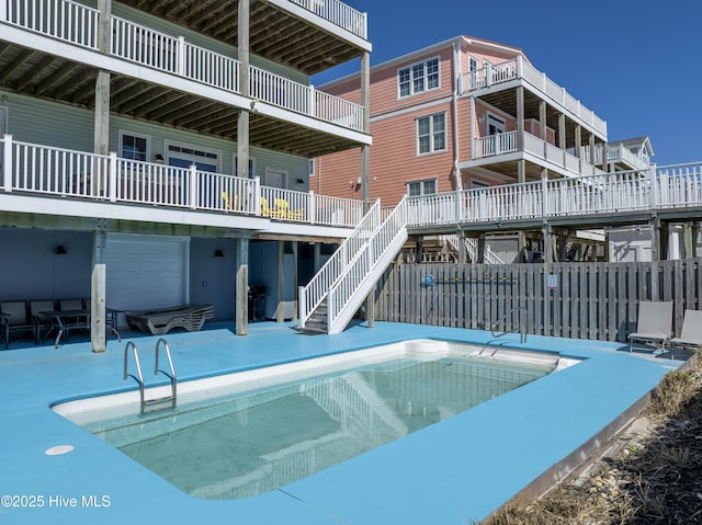 view of pool featuring a patio area, fence, and a fenced in pool