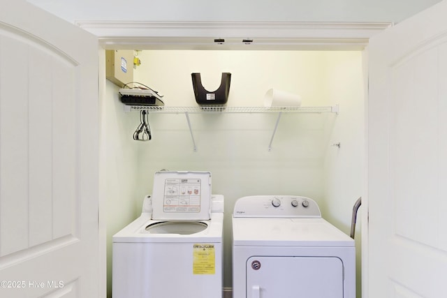 laundry area featuring laundry area and washer and clothes dryer