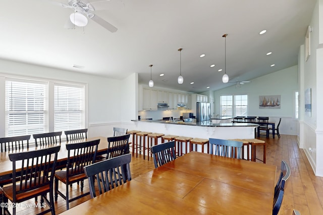 dining room with lofted ceiling, recessed lighting, visible vents, a ceiling fan, and light wood-type flooring