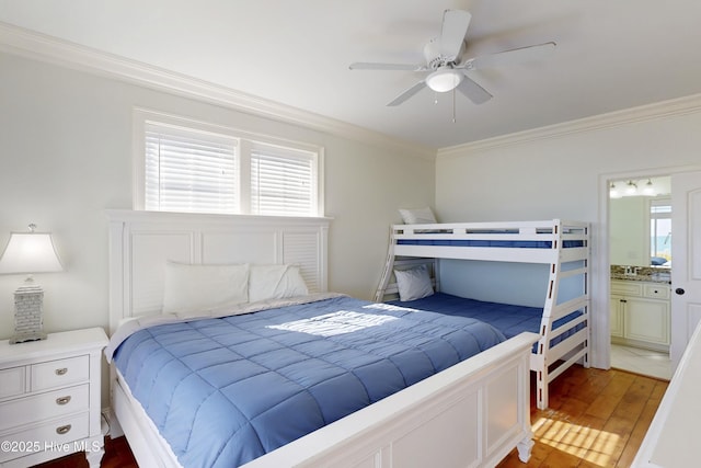 bedroom featuring ceiling fan, crown molding, and wood finished floors