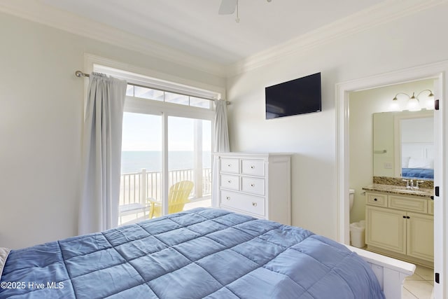 bedroom with light tile patterned floors, connected bathroom, access to exterior, crown molding, and a sink