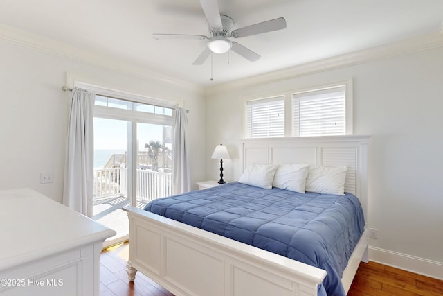 bedroom featuring wood finished floors, a ceiling fan, baseboards, access to outside, and ornamental molding