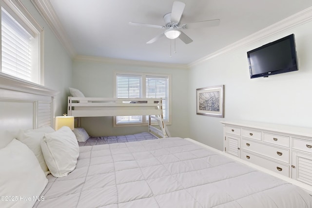 bedroom featuring a ceiling fan and crown molding